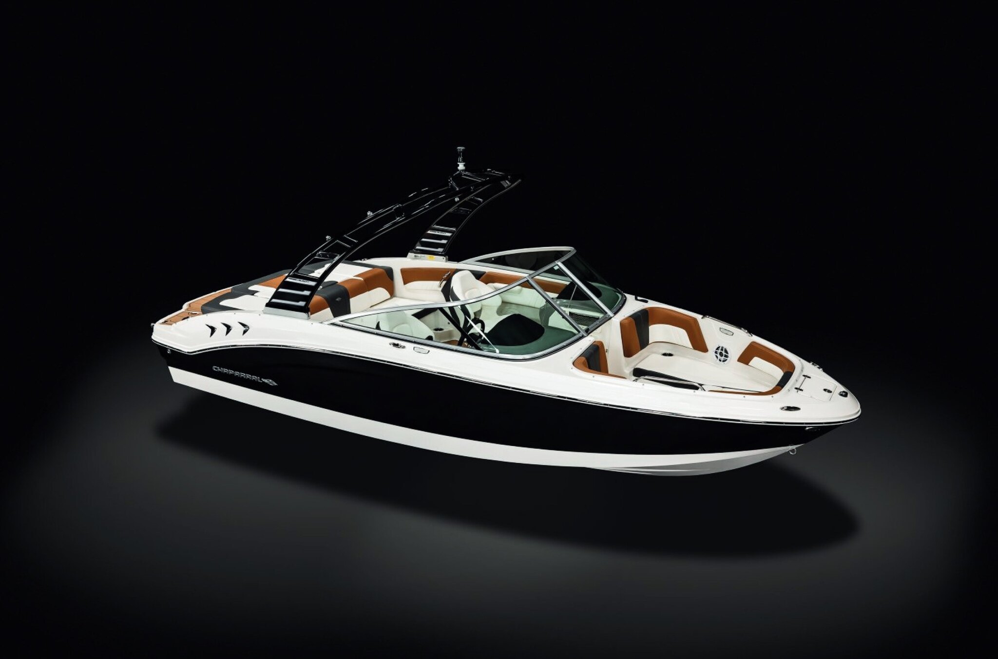 A sleek black and white boat with brown and white seats on a black background